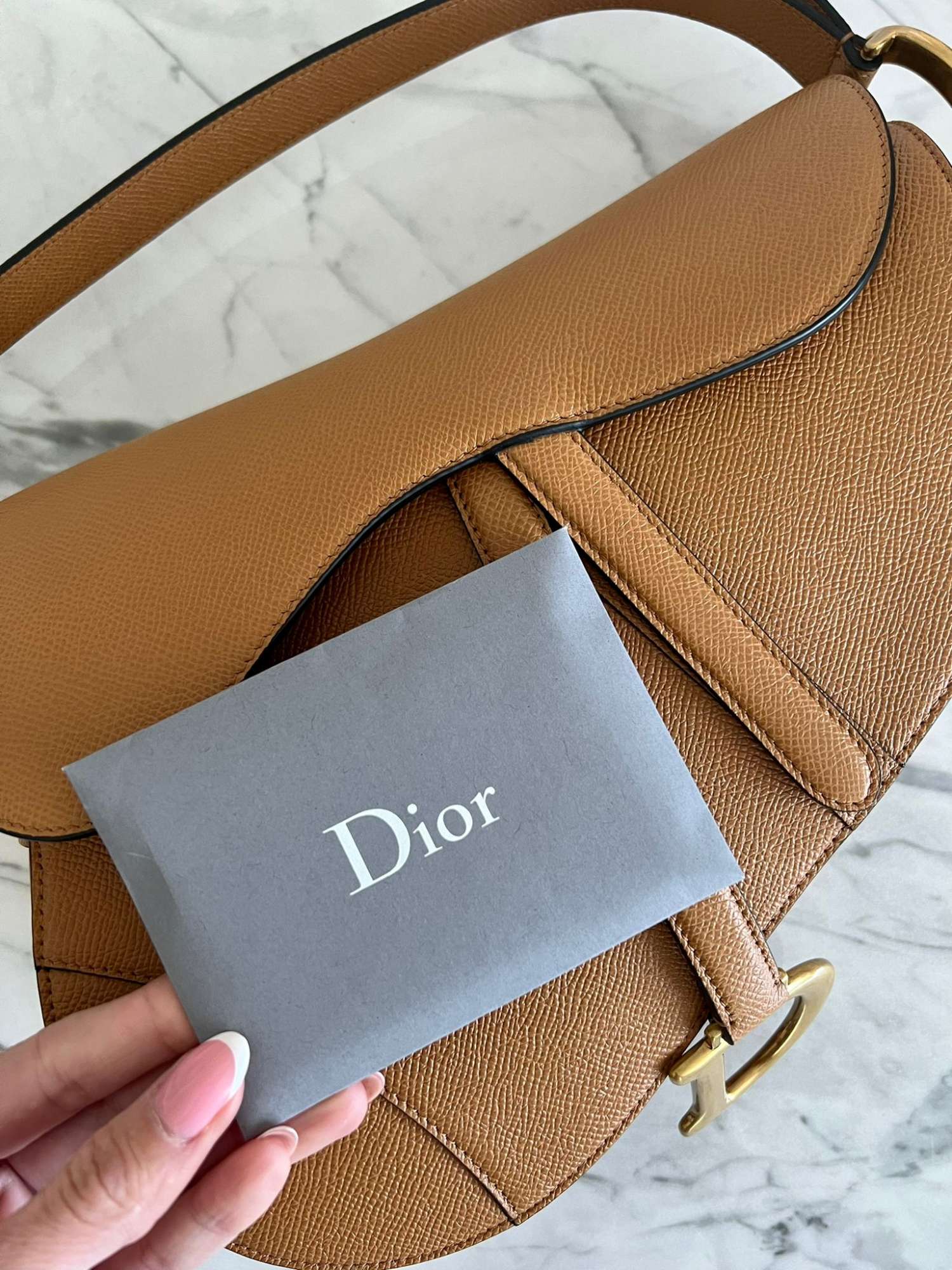Christian Dior saddle kabelka