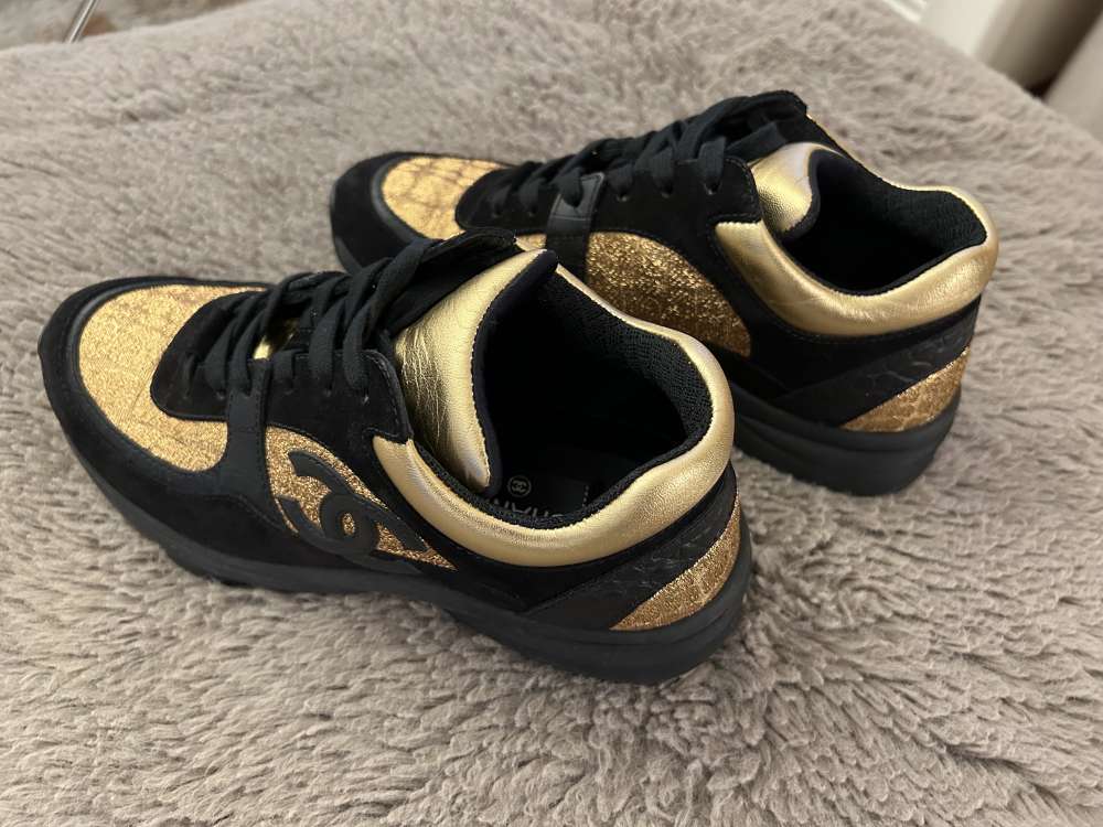 CHANEL Black/Gold Suede and Leather CC Low Top Sneakers