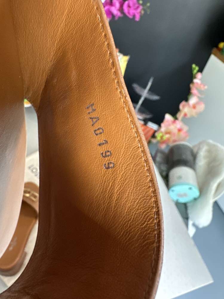 Louis Vuitton Lock it leather Mules
