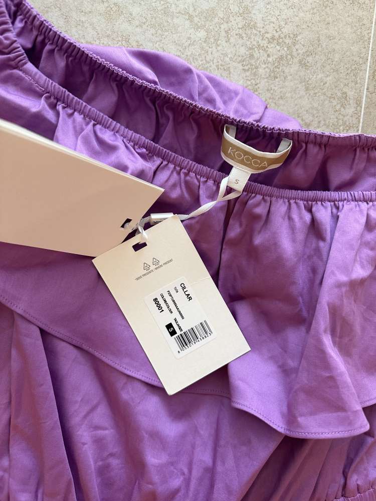 Fialovy overal Kocca